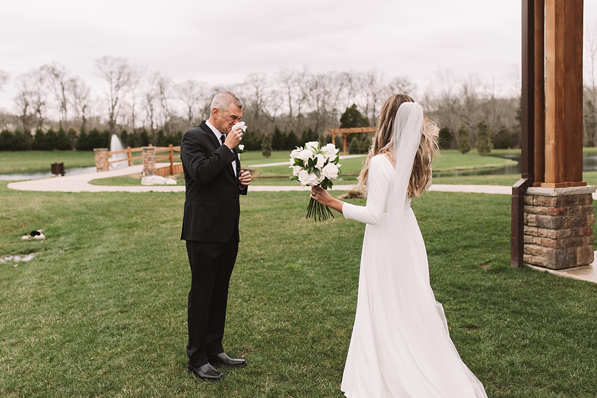 Father of the bride crying after seeing his daughter in her wedding dress for the first time