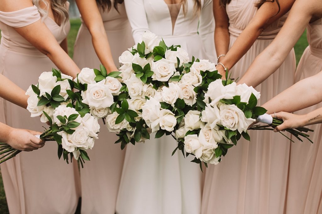 White rose bouquets with greenery