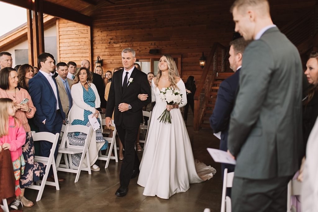 Bride walking with her dad down the aisle
