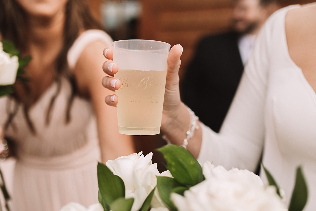 Bride holding celebratory drink