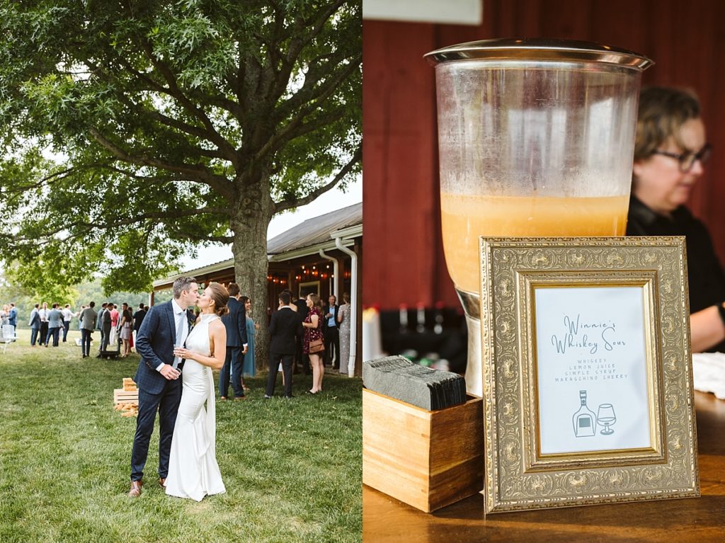 Whiskey sour specialty cocktail during cocktail hour with bride and groom kissing under a tree