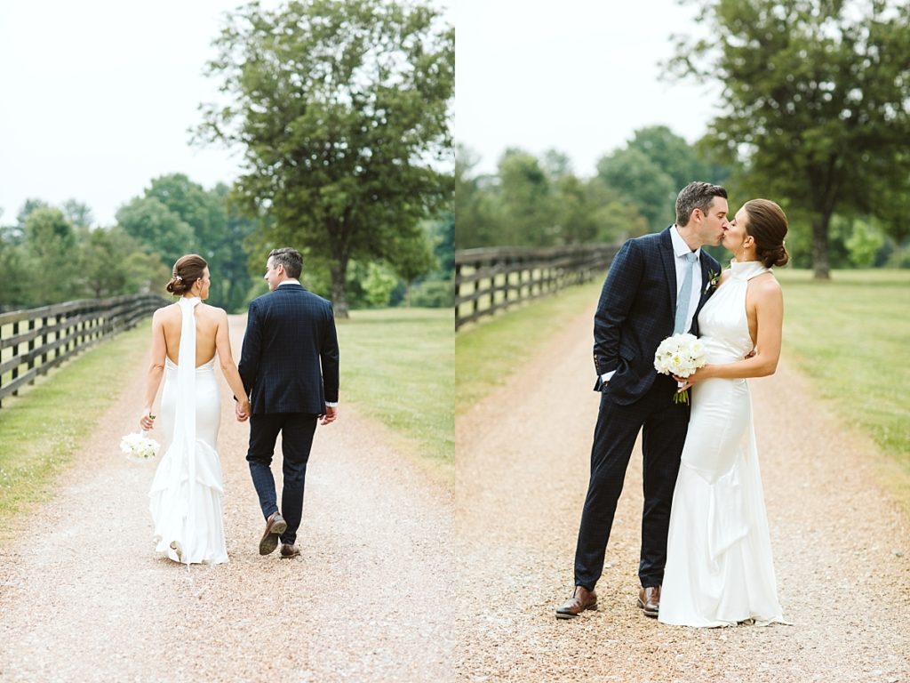 Newlyweds strolling together down a pebble road and then sharing a kiss