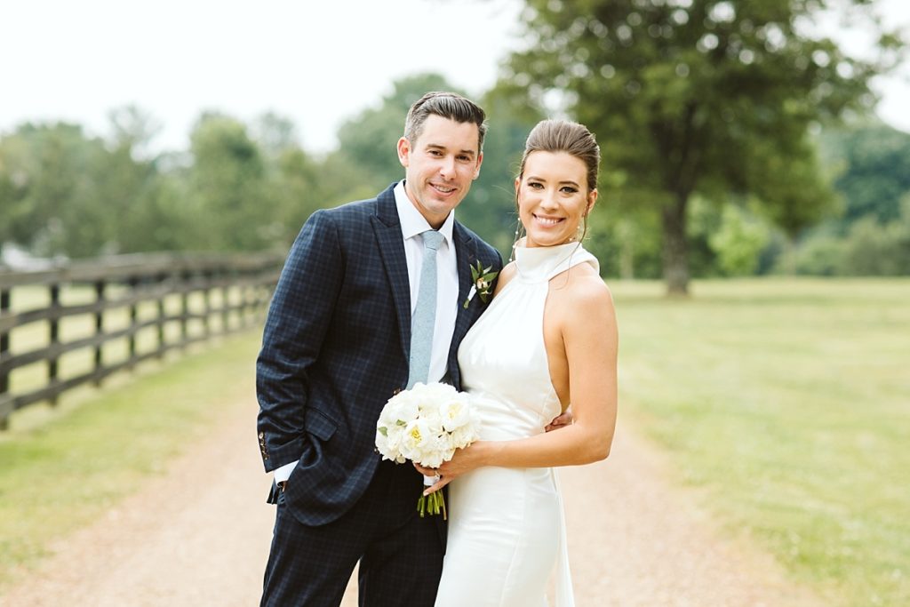 Portrait of a bride and groom on a country road at Cedarmont Farm
