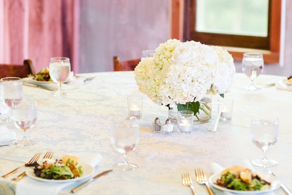 Hydrangea and rose all white compote on reception table
